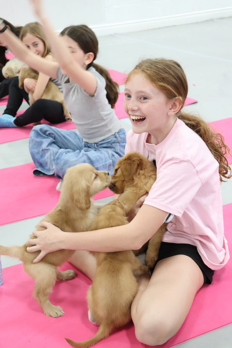 A birthday celebration at Puppy Yoga Studio